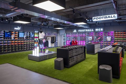 Interior of Sports Direct Manchester store showing football equipment and clothing